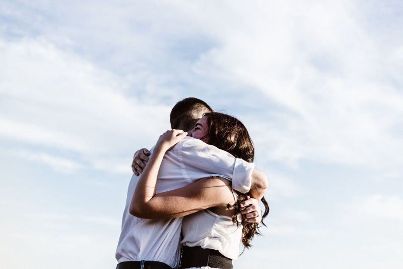 A couple hugging each other intensely