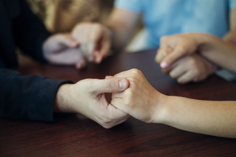 Hands touching each other in a gesture of solidarity