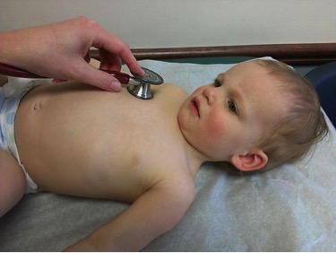 Child under physical exam. Wikipedia