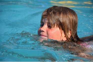 Child doing physical therapy in the swimming pool. Pexels