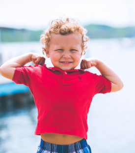 boy standing near dock