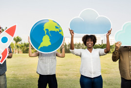 Several people holding diverse objects like a rocket or the globe