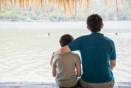 Father and son on a dock