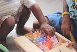 Children playing with chalks