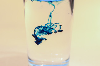 Ink inside a glass of water