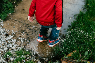 Child jumping in water