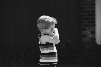 Blonde boy tired or sleppy BW pic