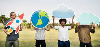 Several people holding diverse objects like a rocket or the globe