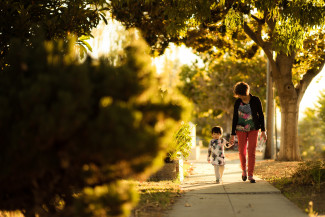 Mother and small daughter taking a walk