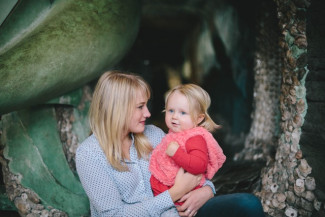 Mum holding kid 