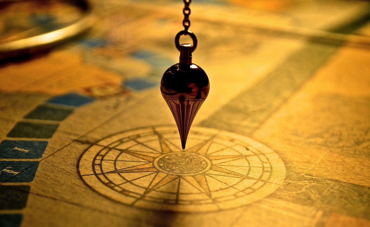A pendulum over a map